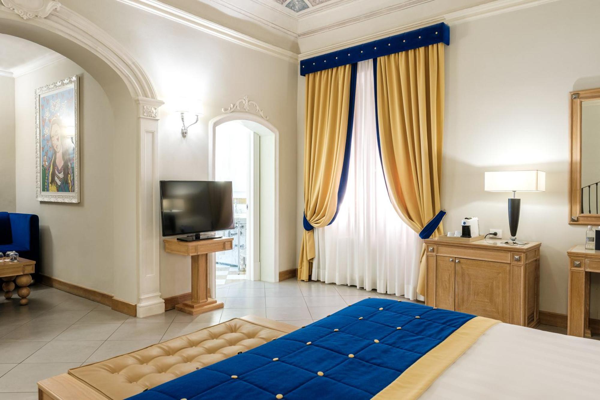 Villa Tolomei Hotel & Resort Флоренция Экстерьер фото A bedroom at the hotel